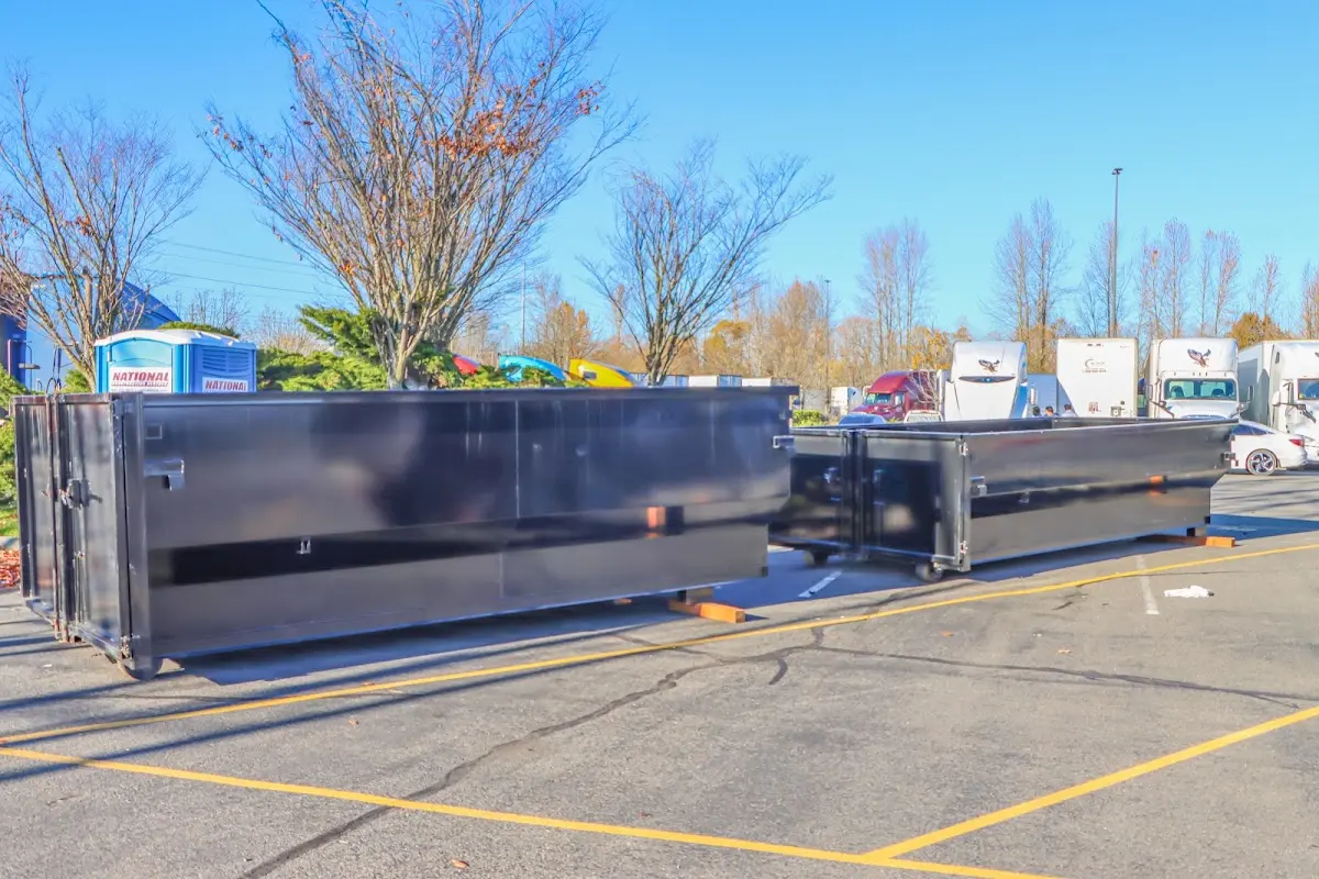 Professional dumpster rental service with roll-off container on residential driveway in University of California-Davis